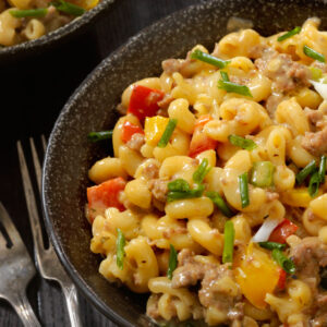 Creamy macaroni pasta with vegetables Veg macaroni pasta with cheese sauce Indian style macaroni street food Cafe style macaroni pasta