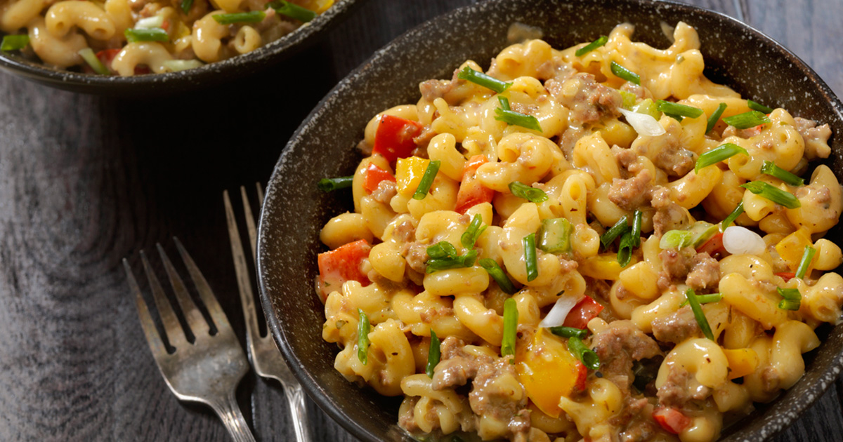 Creamy macaroni pasta with vegetables Veg macaroni pasta with cheese sauce Indian style macaroni street food Cafe style macaroni pasta