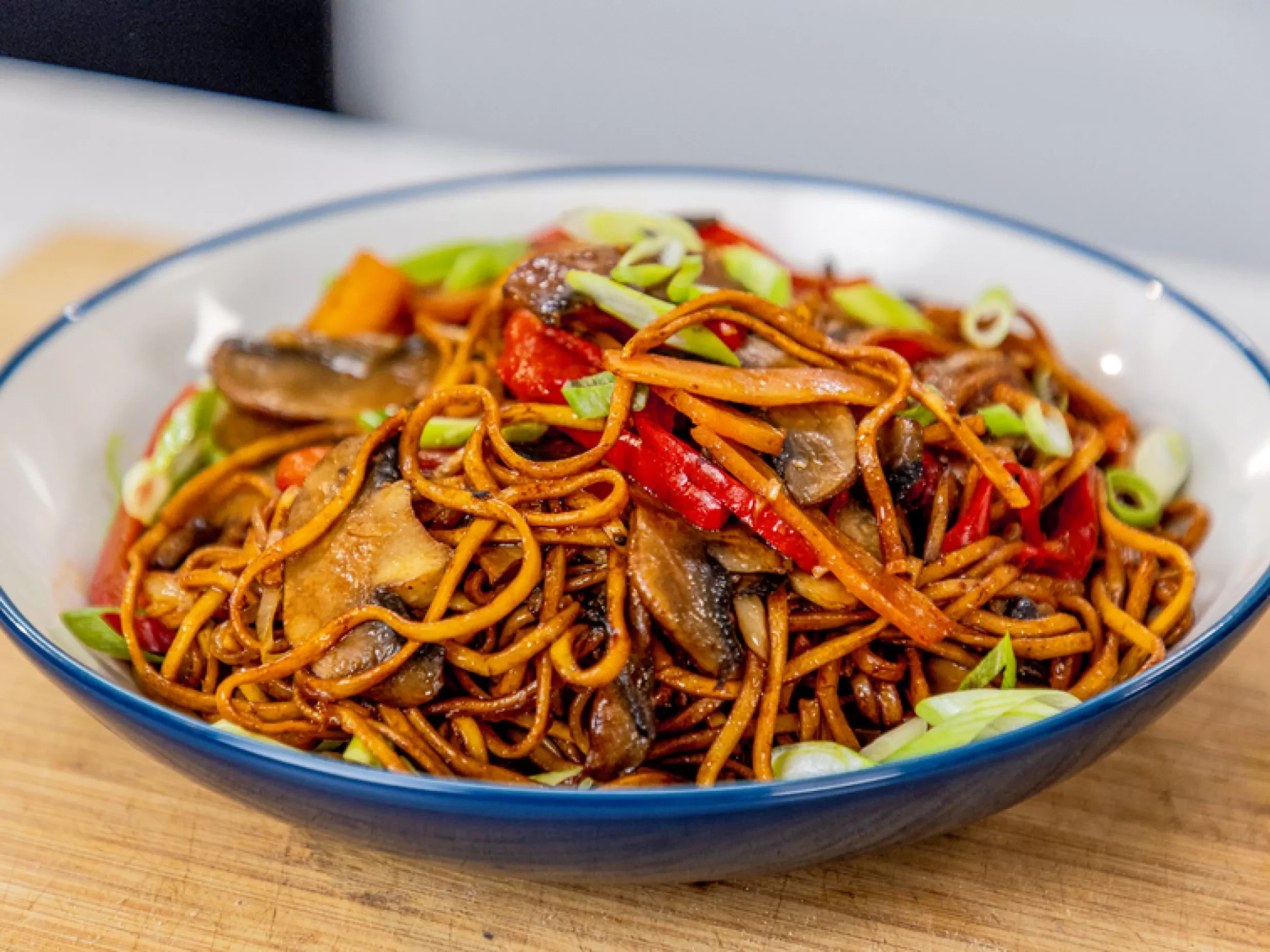 Mushroom noodles with stir fried vegetables Indo Chinese mushroom hakka noodles Noodles with mushrooms and sauces Street style mushroom noodles