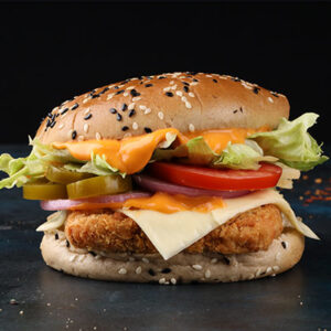 Paneer burger with grilled paneer patty Paneer tikka burger with cheese and veggies Crispy paneer burger cafe style Indian style paneer burger